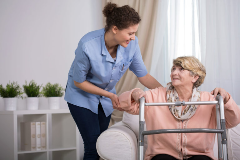 daughter helping mom on walker