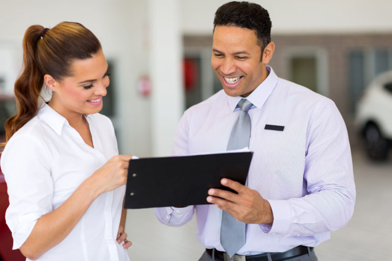 co workers looking at tablet